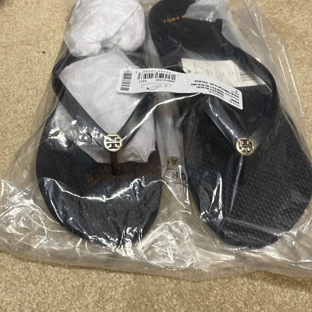 Tory Burch black flip-flops. Brand new with tags size 9